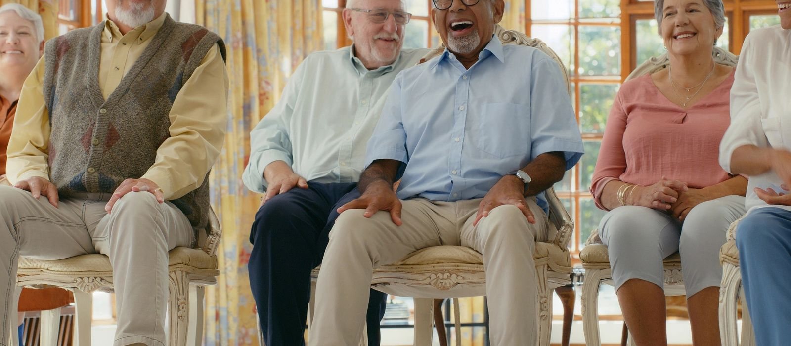 Happy senior residents in a warm residential care home